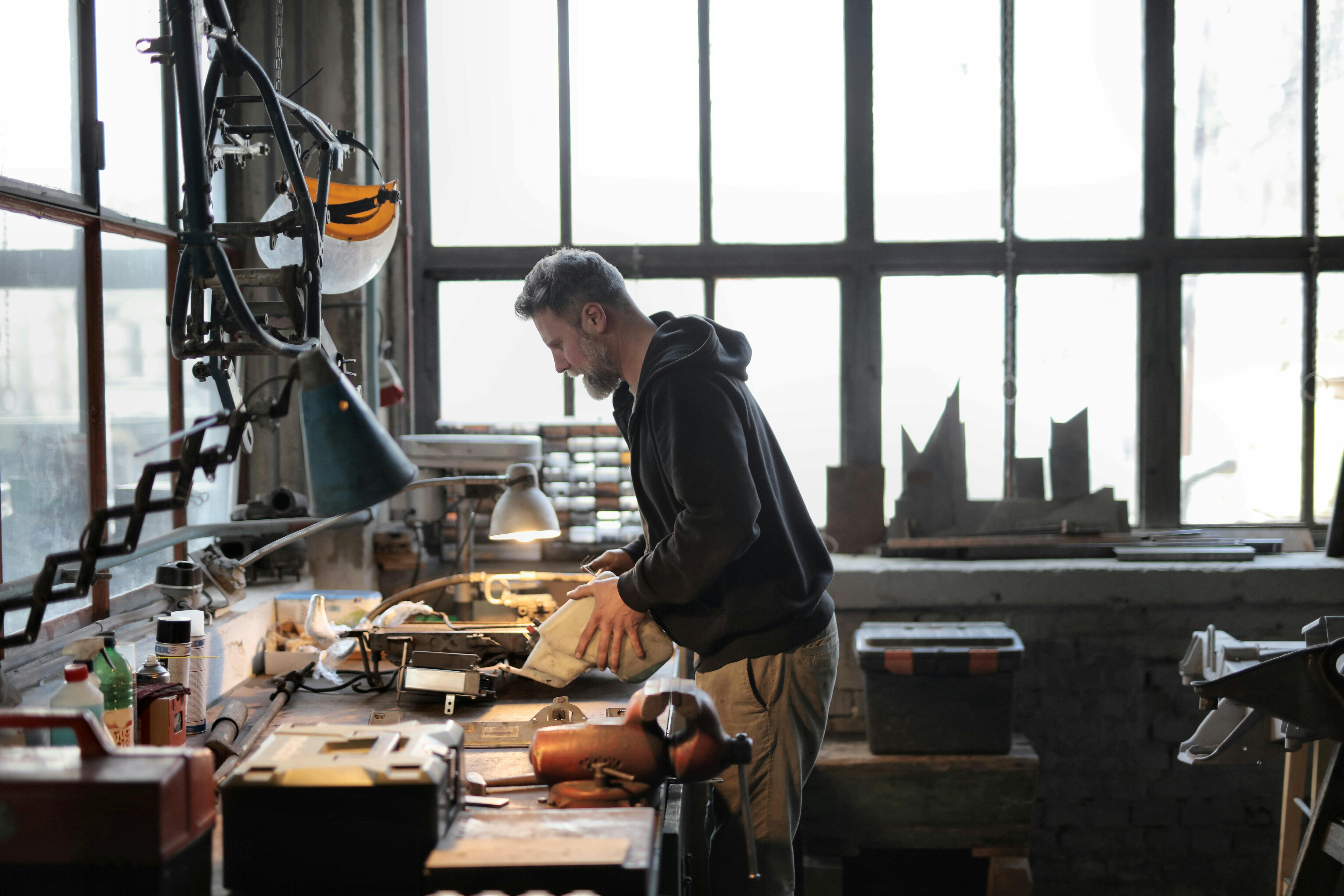 Tradesman working at his workbench in a workshop