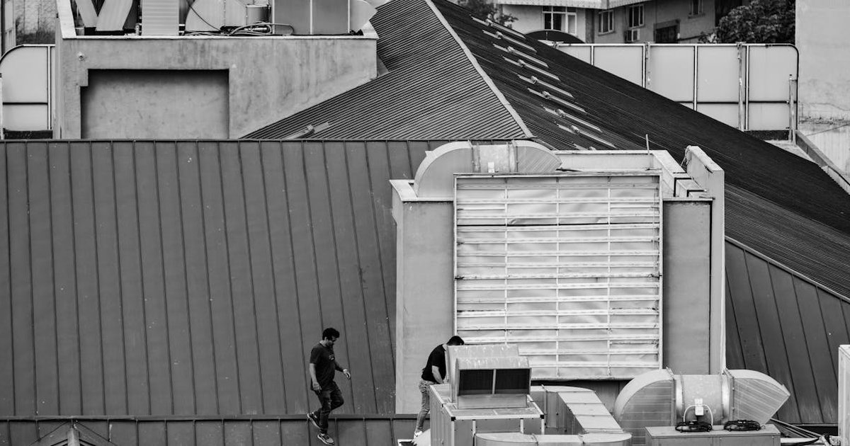 HVAC technician on a job site missing a call on their smartphone